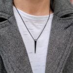 Dainty black bar pendant necklace worn