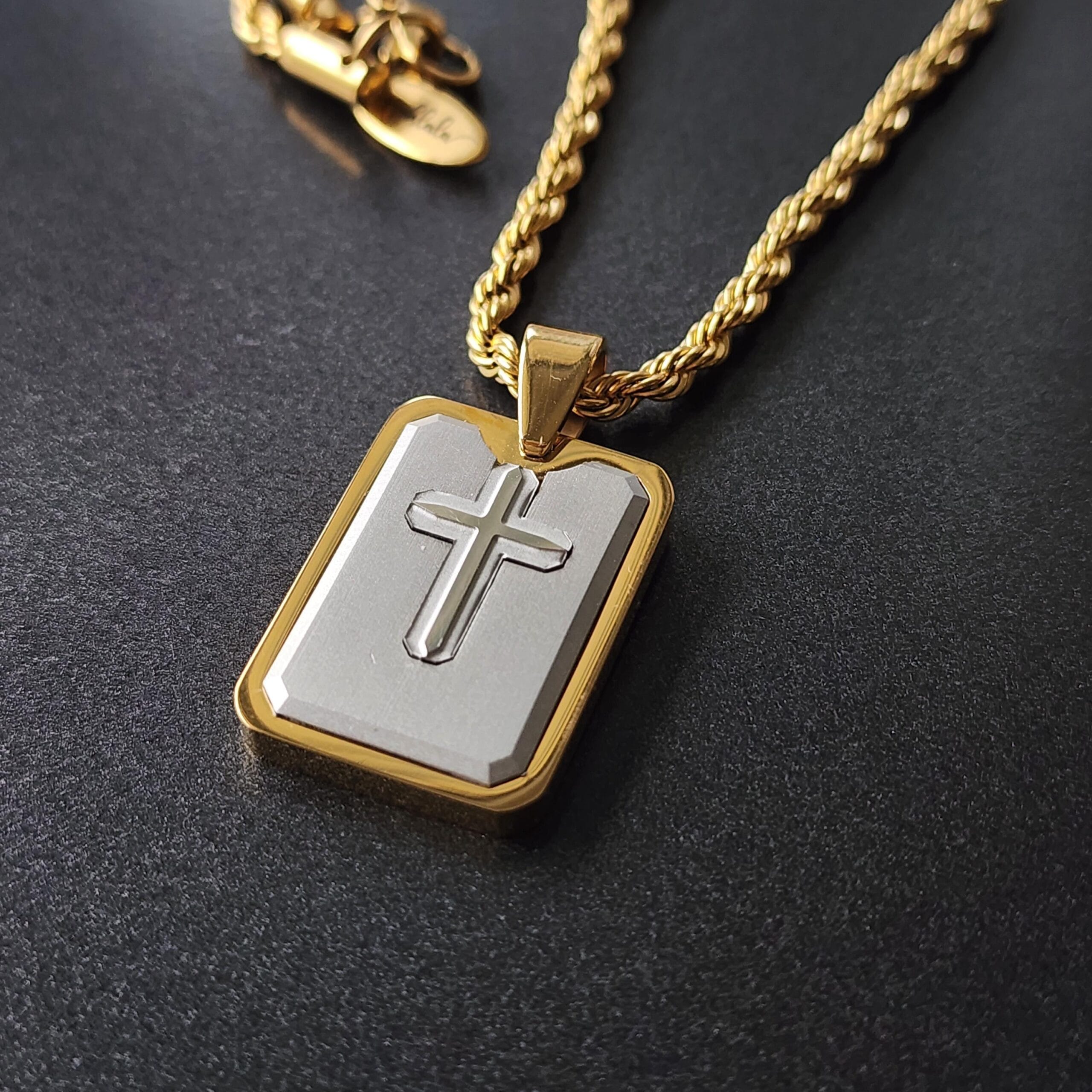 Engraved Cross Dog Tag Necklace, Gold and Silver Stainless Steel, Personalized Gift 7 Cross dog tag on a dark background